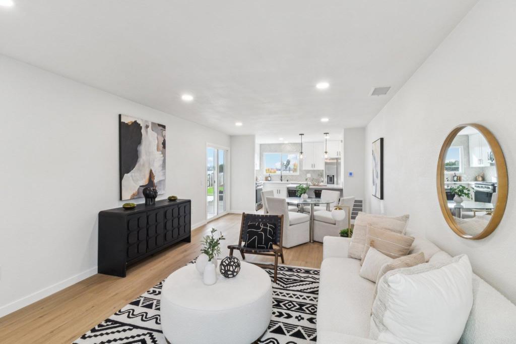 4723 Rim Rock Road Oceanside, CA 92056 - Photo 3 of 29 a living room with furniture a large window and a table