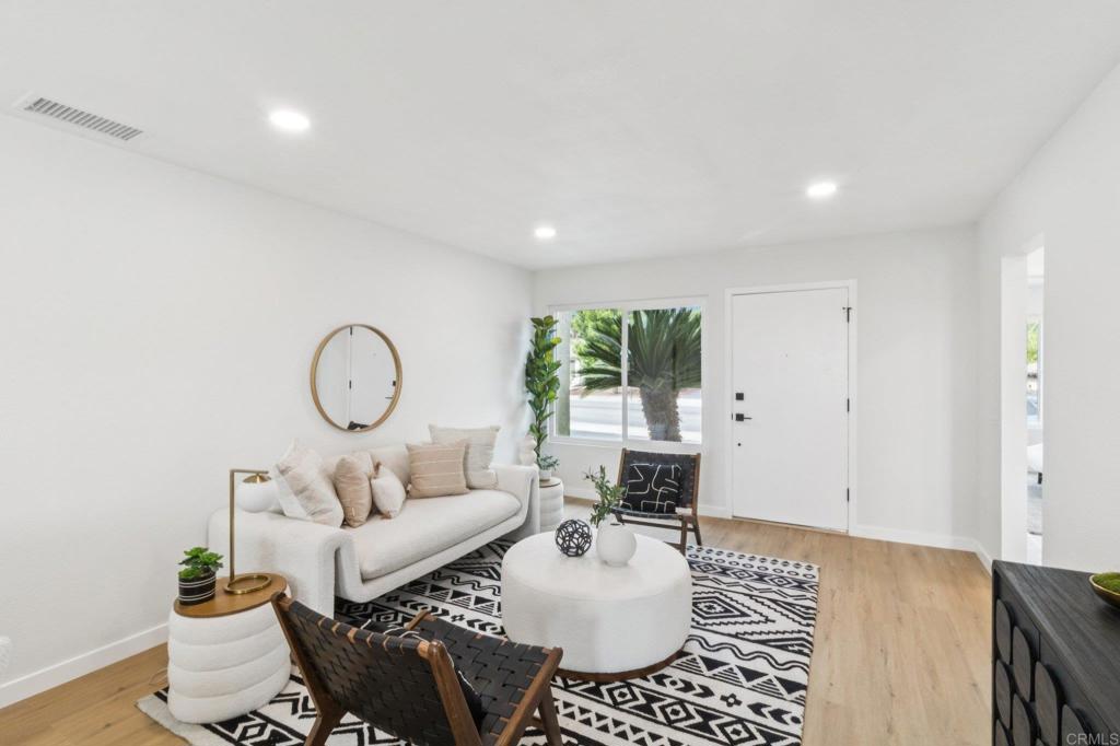 4723 Rim Rock Road Oceanside, CA 92056 - Photo 5 of 29 a living room with furniture a window and a table