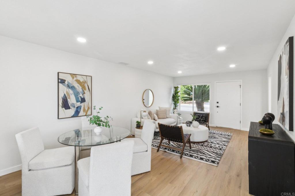 4723 Rim Rock Road Oceanside, CA 92056 - Photo 9 of 29 a living room with furniture a rug and a large window