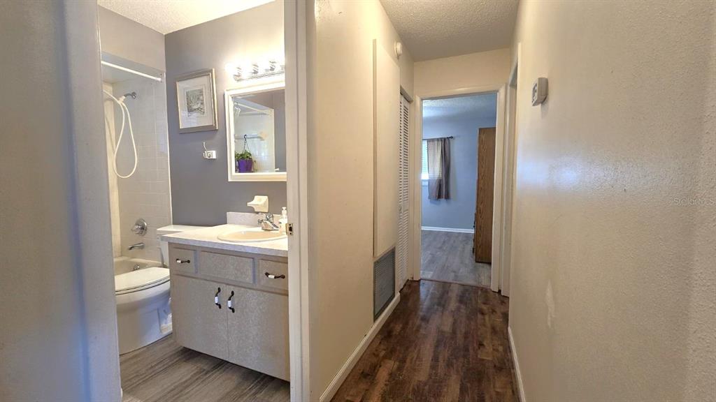 9430 Southwest 102nd Place Ocala, FL 34481 - Photo 16 of 51 a bathroom with a granite countertop sink toilet and shower