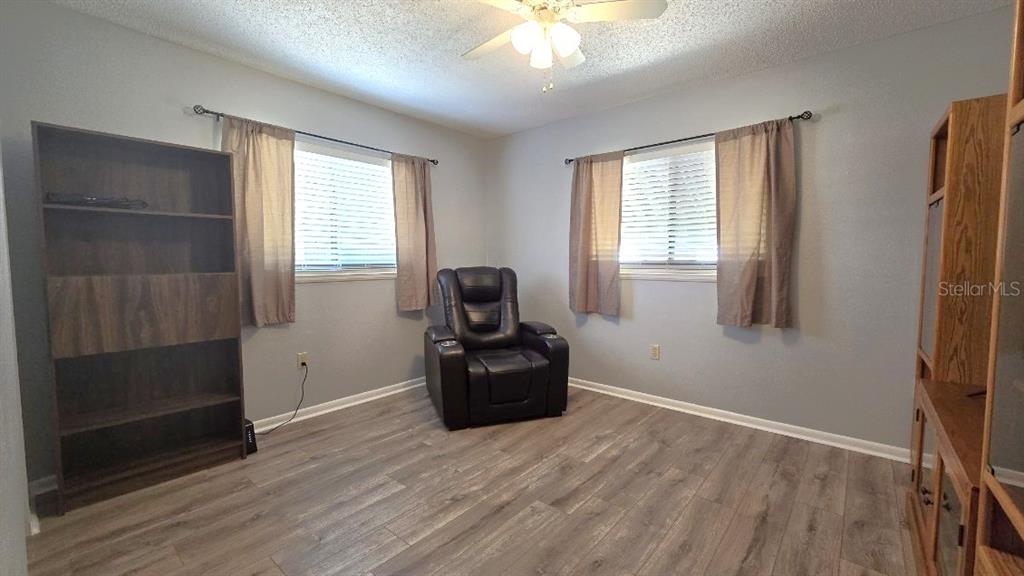 9430 Southwest 102nd Place Ocala, FL 34481 - Photo 18 of 51 a room with window and hardwood floor