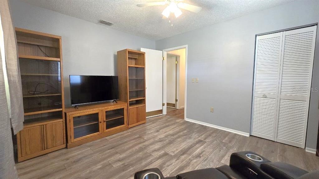 9430 Southwest 102nd Place Ocala, FL 34481 - Photo 19 of 51 a view of a livingroom with furniture and a flat screen tv