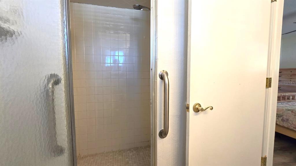 9430 Southwest 102nd Place Ocala, FL 34481 - Photo 25 of 51 a bathroom with a shower