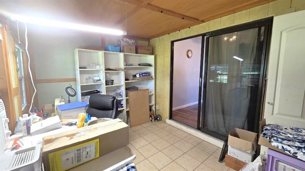 9430 Southwest 102nd Place Ocala, FL 34481 - Photo 28 of 51 a room with furniture a rug and a window