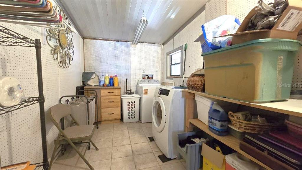 9430 Southwest 102nd Place Ocala, FL 34481 - Photo 31 of 51 a room with storage and utility