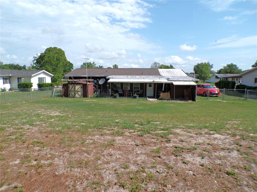 9430 Southwest 102nd Place Ocala, FL 34481 - Photo 36 of 51 a view of a house with a yard