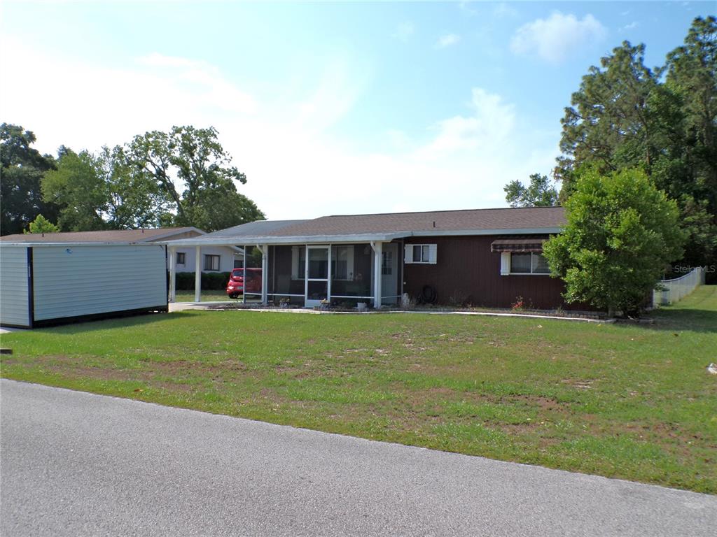 9430 Southwest 102nd Place Ocala, FL 34481 - Photo 40 of 51 a view of a house with a garden