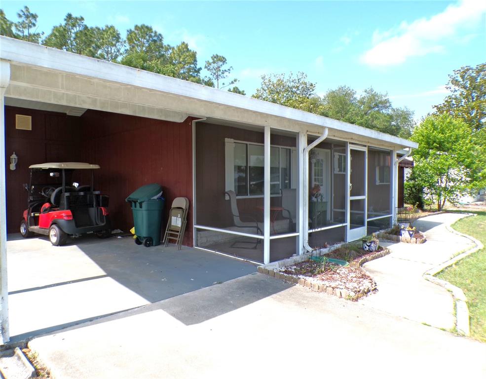 9430 Southwest 102nd Place Ocala, FL 34481 - Photo 4 of 51 a view of a house with backyard porch and sitting area