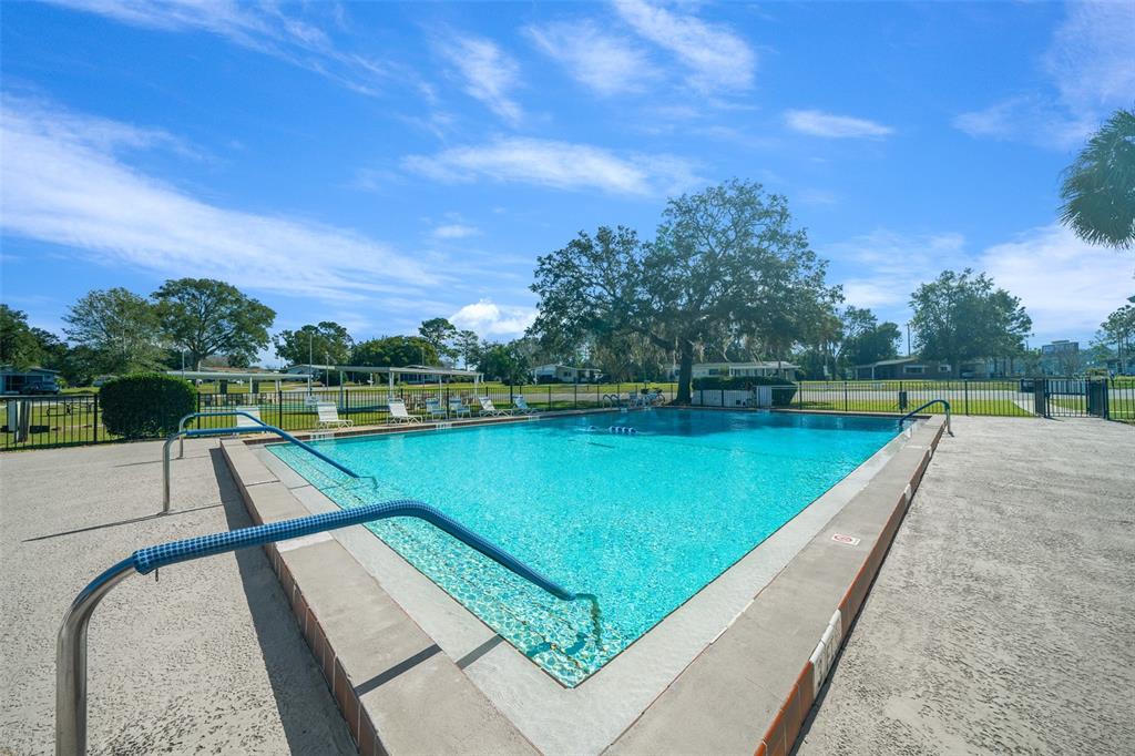 9430 Southwest 102nd Place Ocala, FL 34481 - Photo 47 of 51 a view of a swimming pool with a lake view