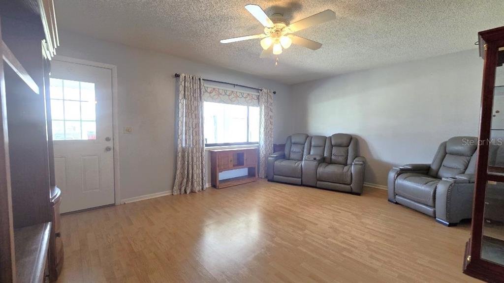 9430 Southwest 102nd Place Ocala, FL 34481 - Photo 10 of 51 a living room with furniture and a window