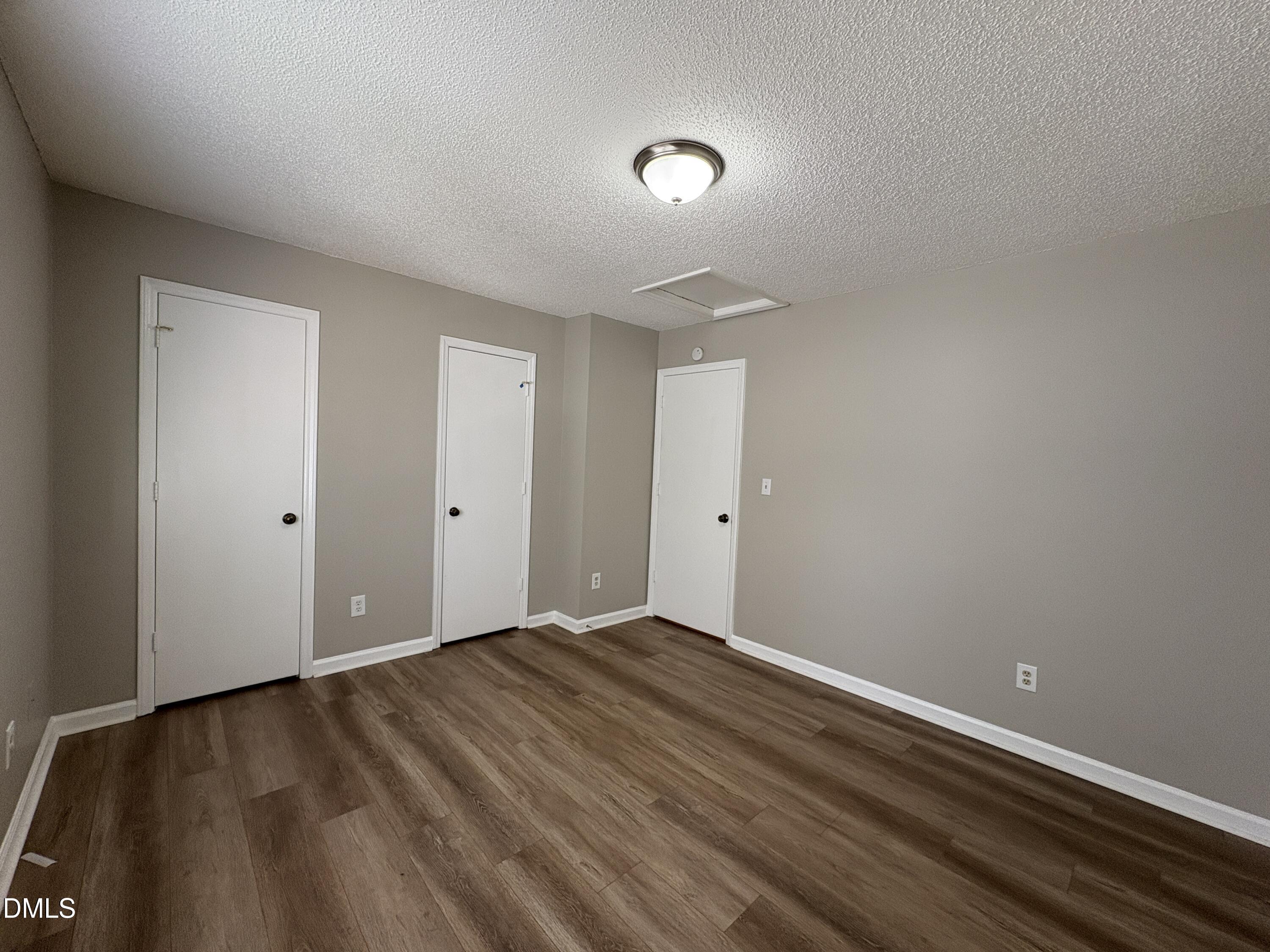 8102 Farmlea Circle Raleigh, NC 27616 - Photo 11 of 16 a view of room with wooden floor