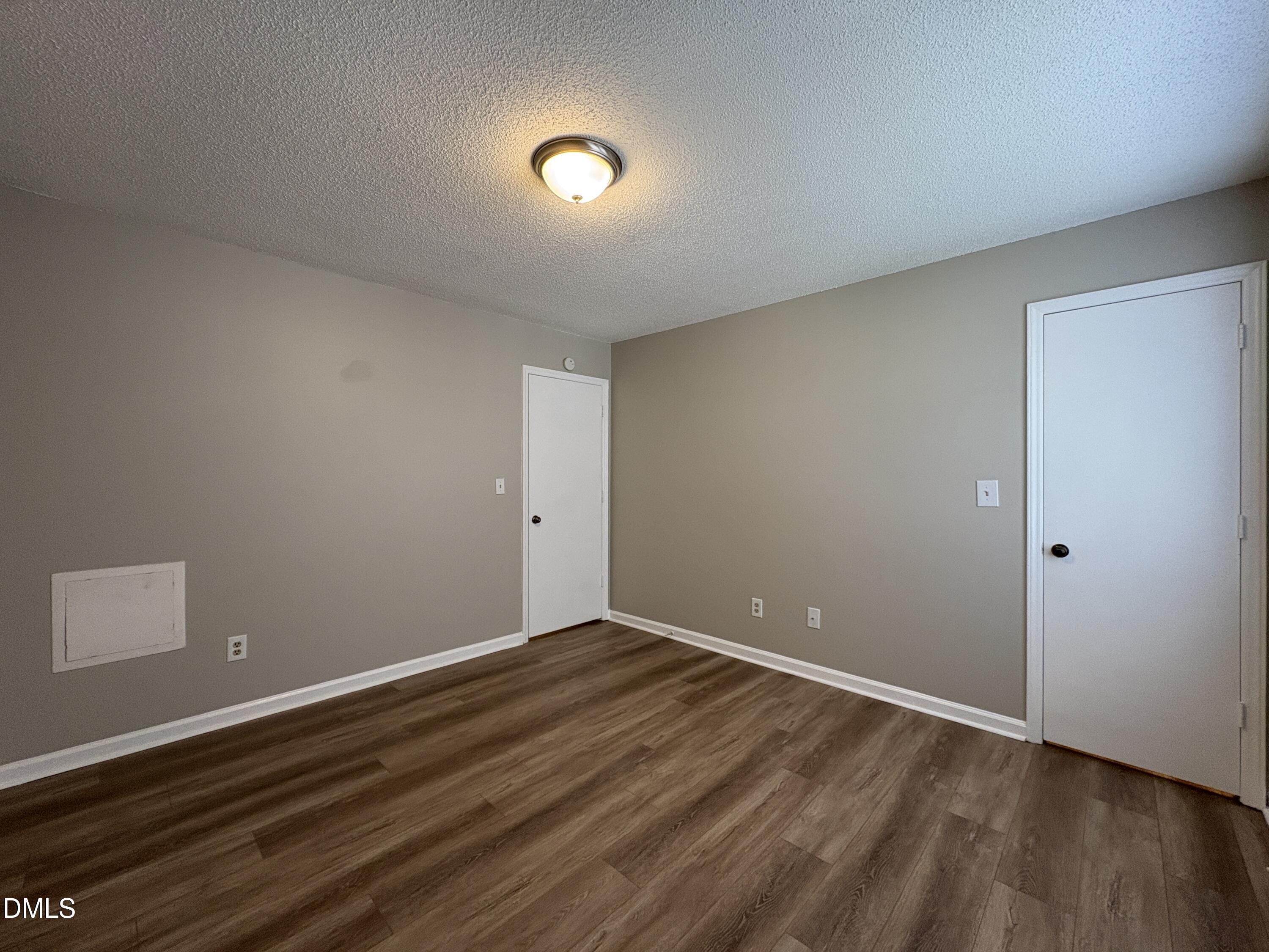 8102 Farmlea Circle Raleigh, NC 27616 - Photo 13 of 16 a view of room with wooden floor