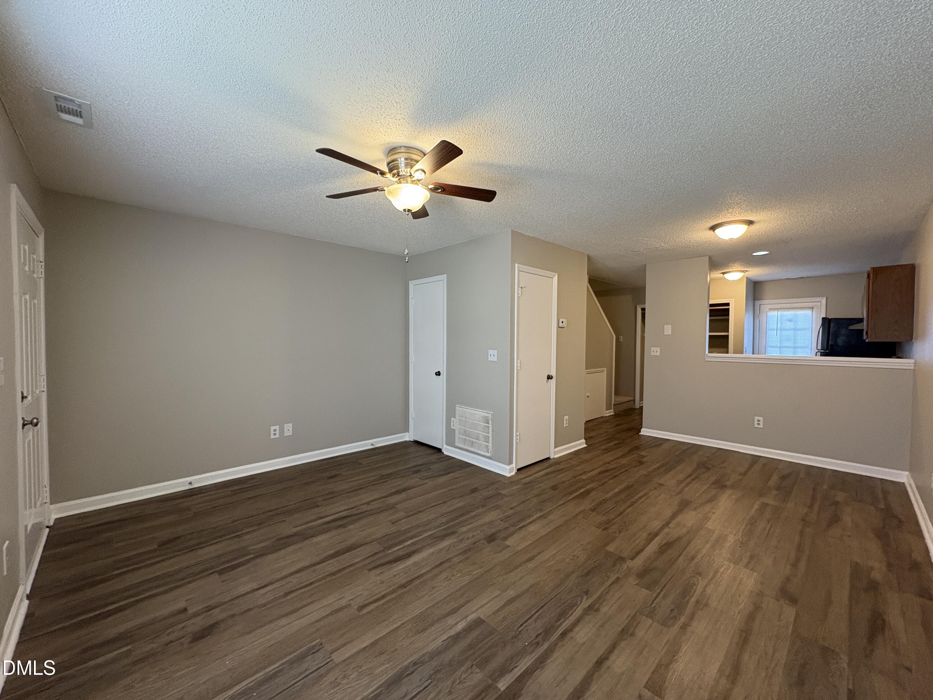 8102 Farmlea Circle Raleigh, NC 27616 - Photo 2 of 16 a view of an empty room with a window and wooden floor