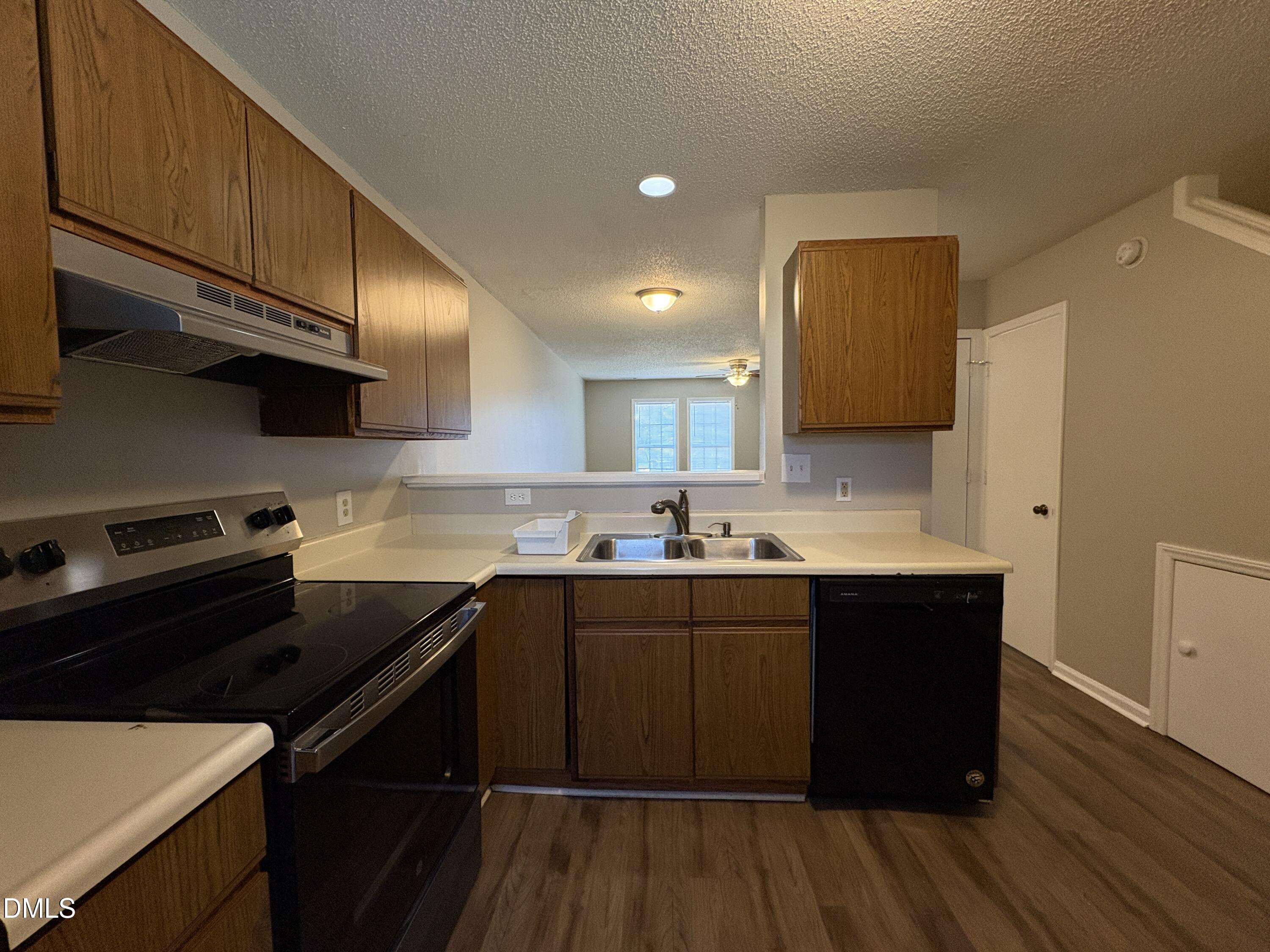 8102 Farmlea Circle Raleigh, NC 27616 - Photo 6 of 16 a kitchen with a sink and cabinets