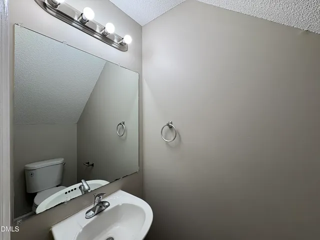 a bathroom with a sink and mirror
