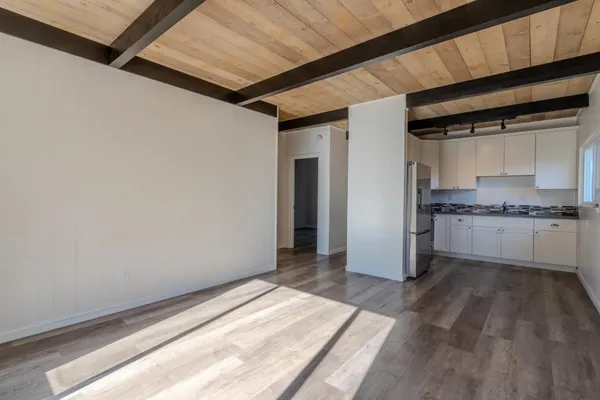 a view of a kitchen with a sink and dishwasher