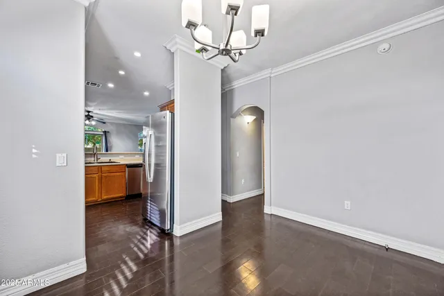 a view of a kitchen with a sink and stainless steel appliances