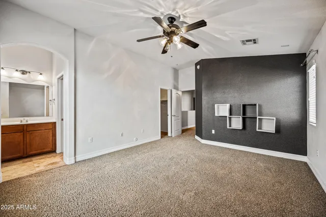 a view of a livingroom with a ceiling fan