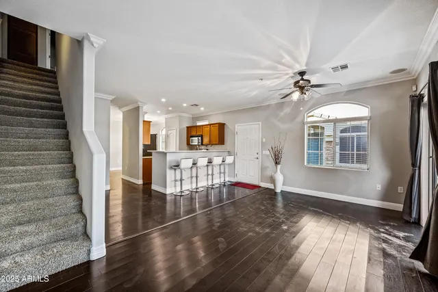 a view of an entryway with wooden floor and door