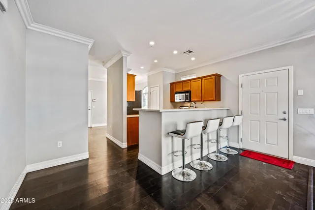 a view of kitchen with furniture and flat screen tv