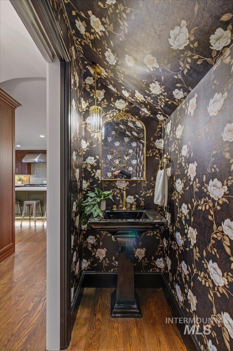 1210 North Harrison Boulevard Boise, ID 83702 - Photo 14 of 39 Bathroom featuring dark wood-type flooring and wallpapered walls