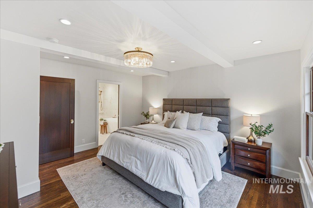 1210 North Harrison Boulevard Boise, ID 83702 - Photo 15 of 39 Bedroom with beamed ceiling, dark wood finished floors, ensuite bath, and hanging lights