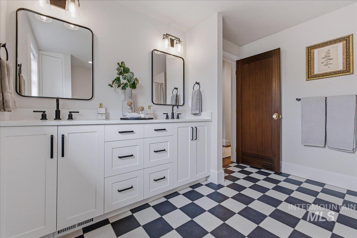 1210 North Harrison Boulevard Boise, ID 83702 - Photo 23 of 39 Full bathroom with double vanity and light floors