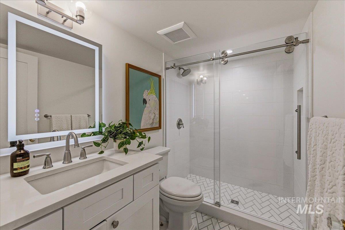 1210 North Harrison Boulevard Boise, ID 83702 - Photo 30 of 39 Bathroom with vanity and a shower stall