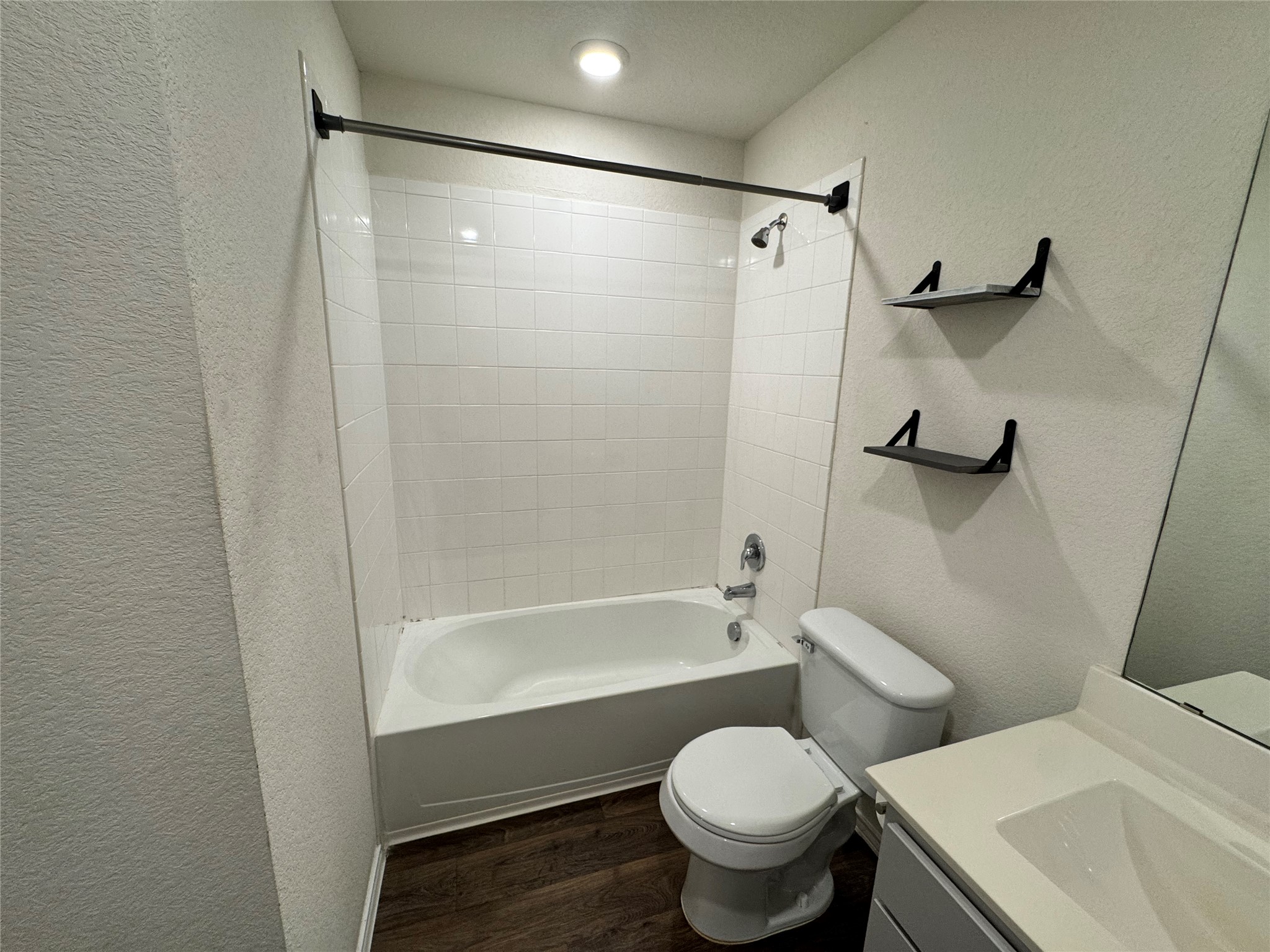 11820 Rush Lane Elgin, TX 78621 - Photo 11 of 31 A well-appointed bath with modern flooring and essential fixtures awaits.