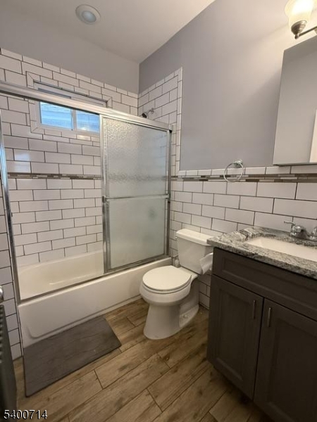 42 North Willow Street, Unit 2 Montclair, NJ 07042 - Photo 8 of 13 a bathroom with a granite countertop toilet sink and shower