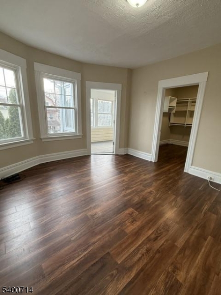 42 North Willow Street, Unit 2 Montclair, NJ 07042 - Photo 9 of 13 an empty room with wooden floor and windows