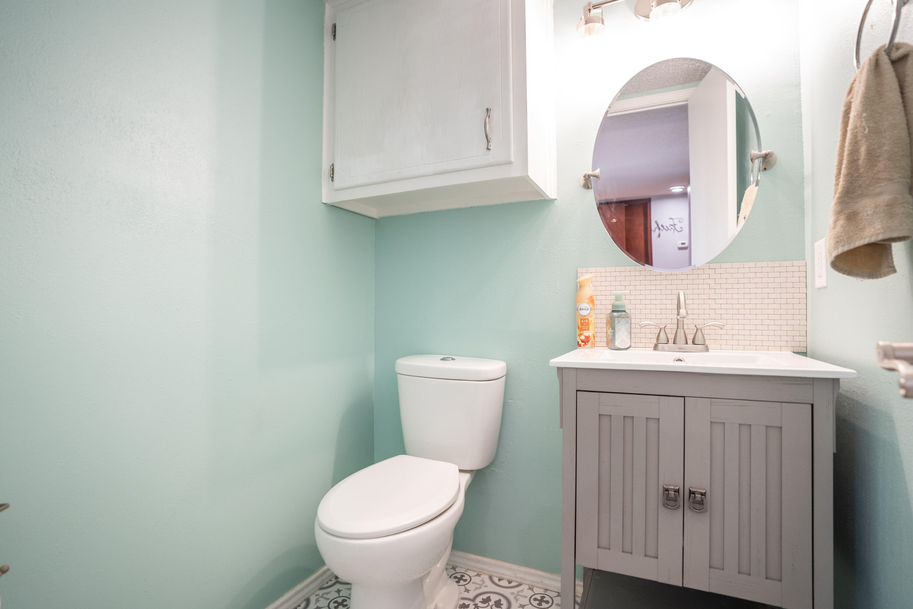 512 North Grover Avenue Lubbock, TX 79416 - Photo 16 of 34 a bathroom with a toilet a sink and mirror