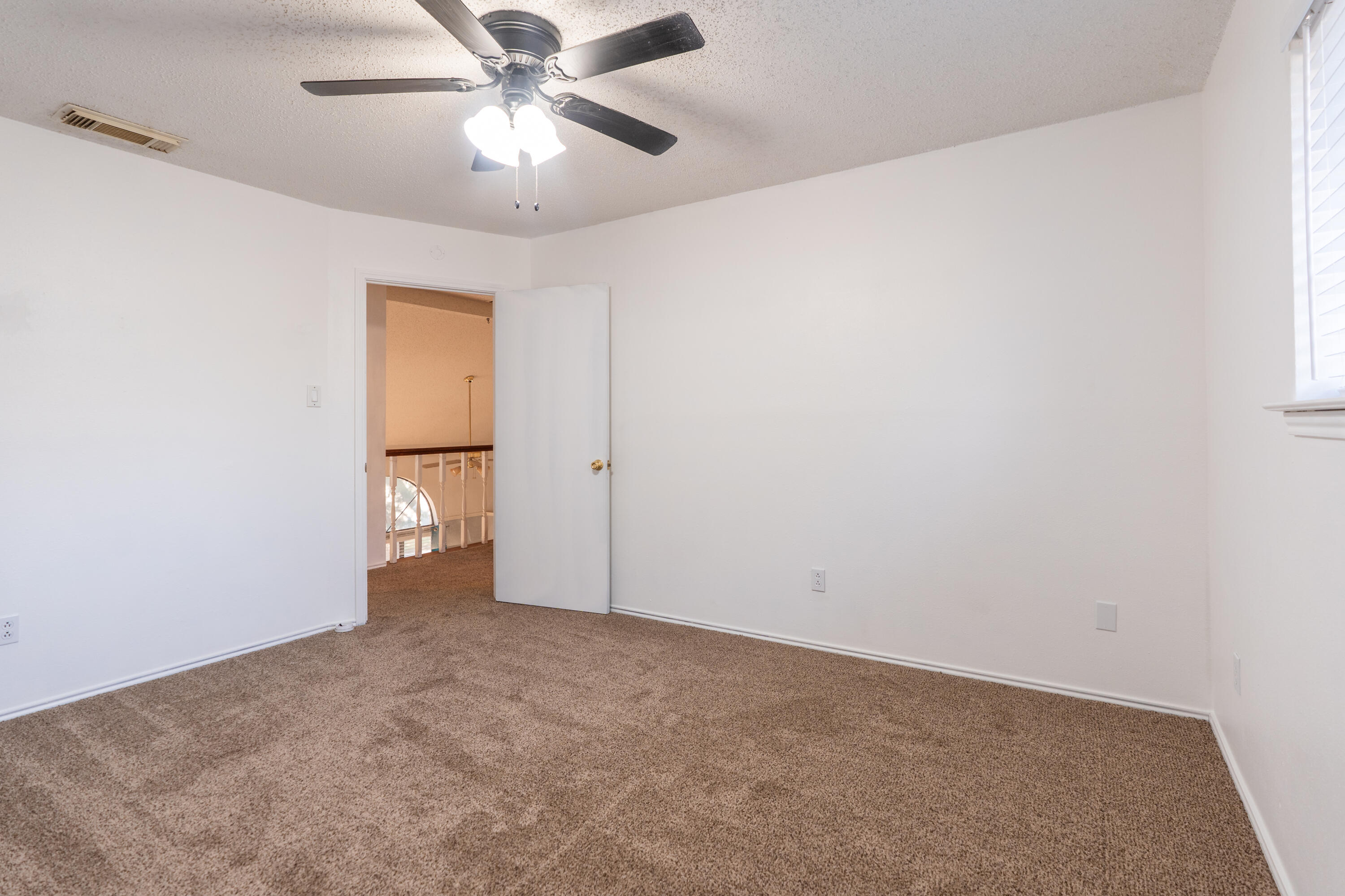 512 North Grover Avenue Lubbock, TX 79416 - Photo 24 of 34 a view of an empty room and a ceiling fan