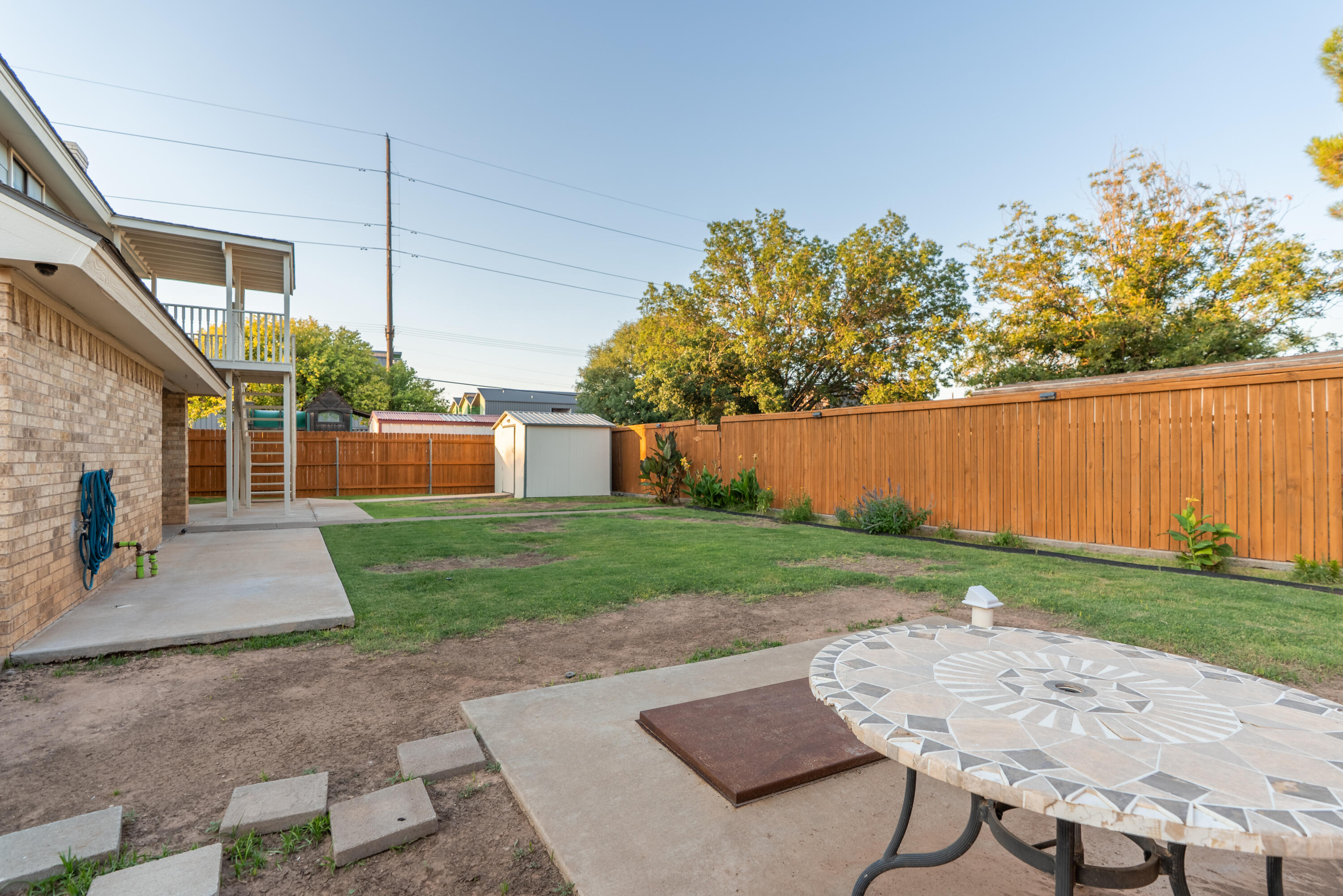 512 North Grover Avenue Lubbock, TX 79416 - Photo 32 of 34 a view of a backyard with plants and a garden