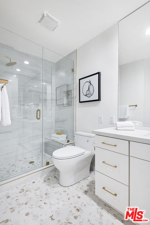 2385 Roscomare Road Los Angeles, CA 90077 - Photo 21 of 38 a bathroom with a sink toilet and shower