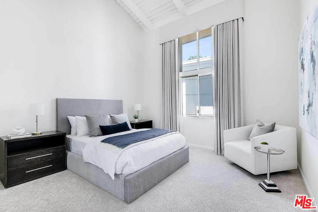 2385 Roscomare Road Los Angeles, CA 90077 - Photo 23 of 38 a bedroom with a bed and a window