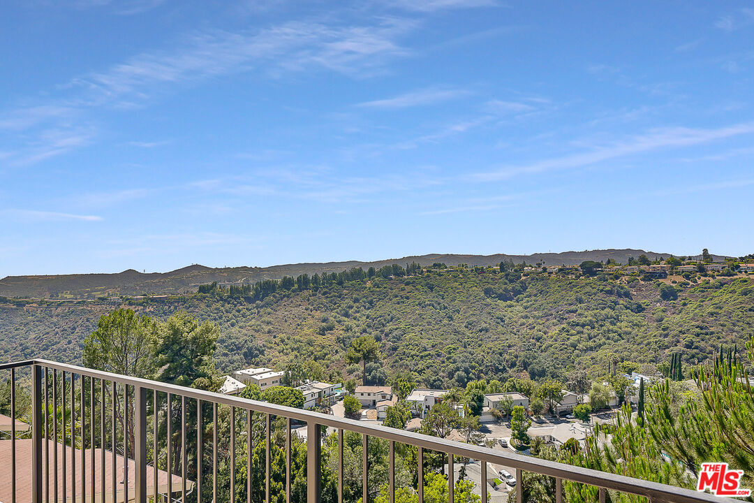 2385 Roscomare Road Los Angeles, CA 90077 - Photo 33 of 38 a view of a city and mountain