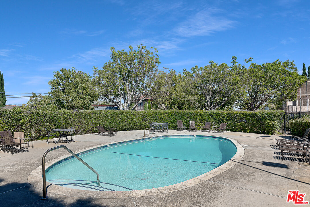 2385 Roscomare Road Los Angeles, CA 90077 - Photo 35 of 38 a view of a swimming pool with a yard