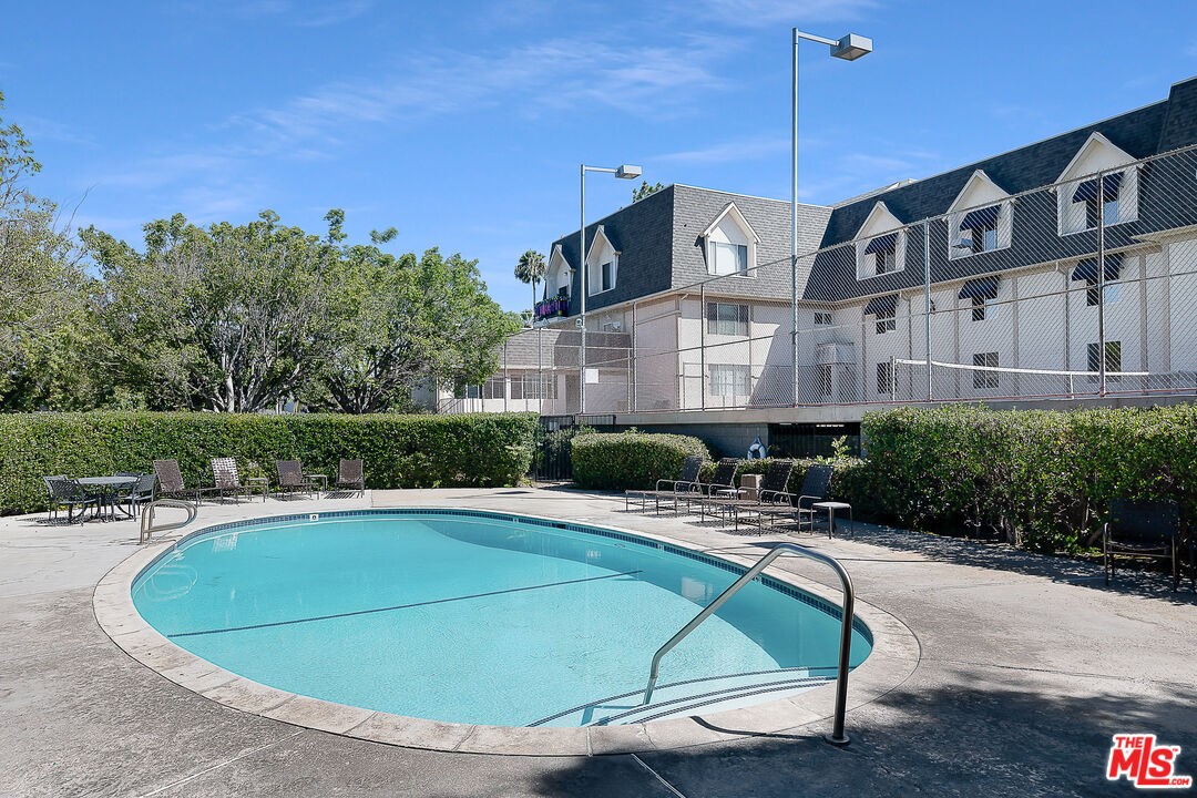 2385 Roscomare Road Los Angeles, CA 90077 - Photo 36 of 38 a view of a swimming pool with a patio