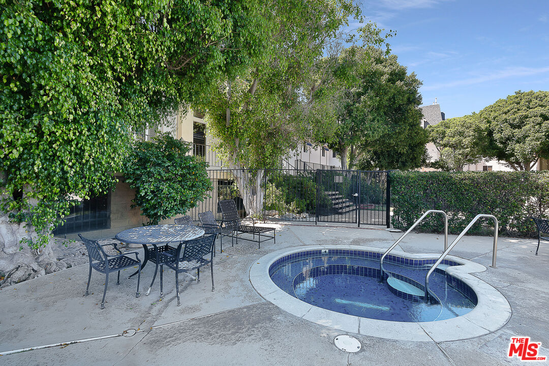 2385 Roscomare Road Los Angeles, CA 90077 - Photo 37 of 38 a view of a chairs and tables in the patio