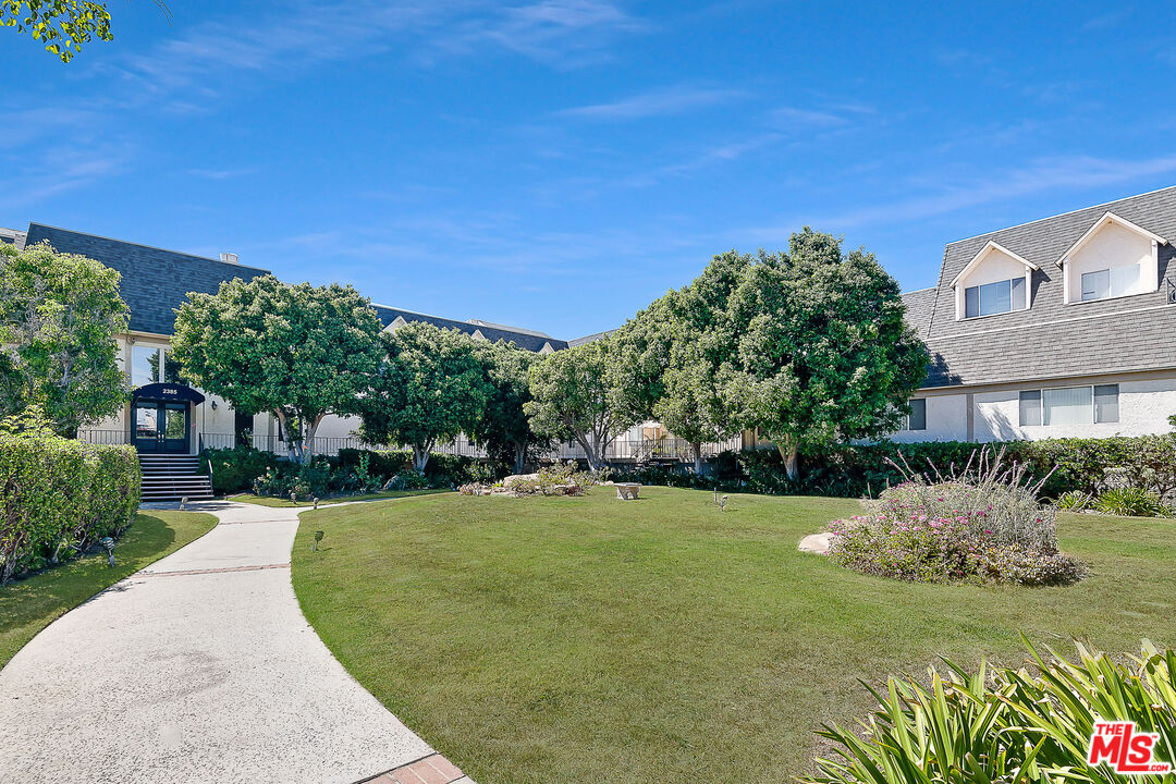 2385 Roscomare Road Los Angeles, CA 90077 - Photo 4 of 38 a view of a house with a yard