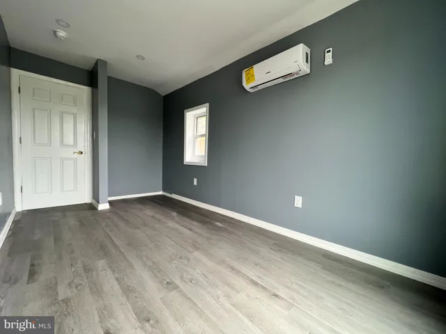 a white toilet sitting next to a shower