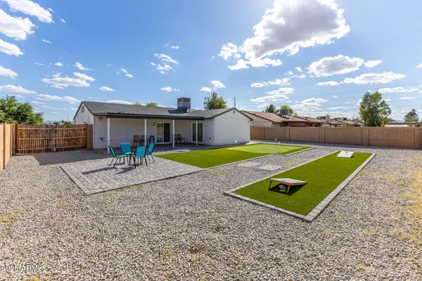 a view of a backyard with a patio