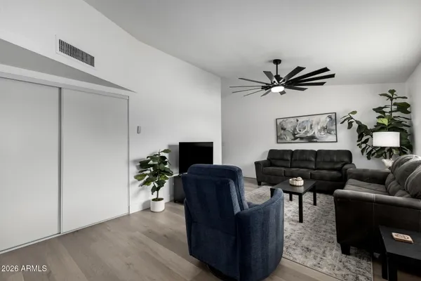 a living room with furniture and a flat screen tv