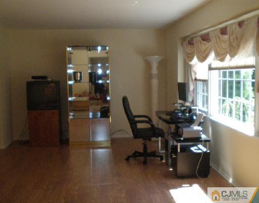 30 Brookside Road Edison, NJ 08817 - Photo 3 of 8 a lobby with furniture and floor to ceiling window