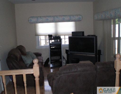 30 Brookside Road Edison, NJ 08817 - Photo 4 of 8 a living room with furniture and a flat screen tv