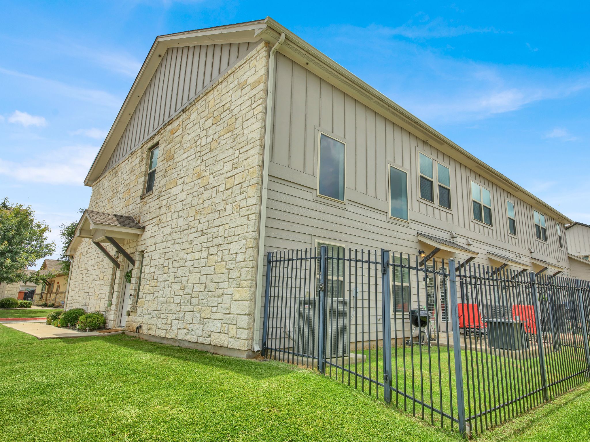 1600 Airedale Road, Unit 2601 Austin, TX 78748 - Photo 25 of 26 A striking blend of stone and siding adorns this end-unit townhome, offering both character and comfort.