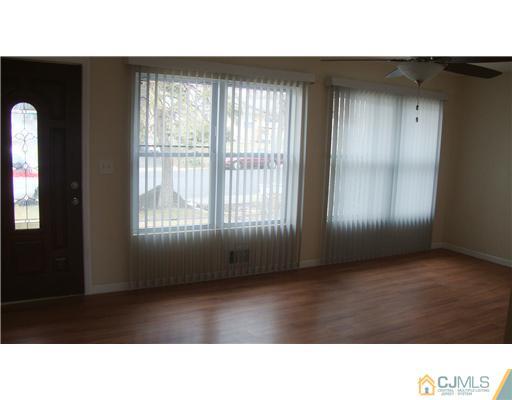 45 Princeton Road Old Bridge, NJ 08859 - Photo 3 of 10 a room with windows and cabinet