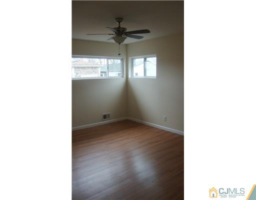 45 Princeton Road Old Bridge, NJ 08859 - Photo 8 of 10 a view of a room that has a window and a ceiling fan