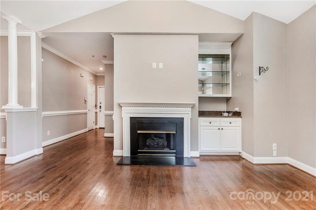 5730 Closeburn Road, Unit N Charlotte, NC 28210 - Photo 11 of 21 a view of a livingroom with wooden floor and a fireplace